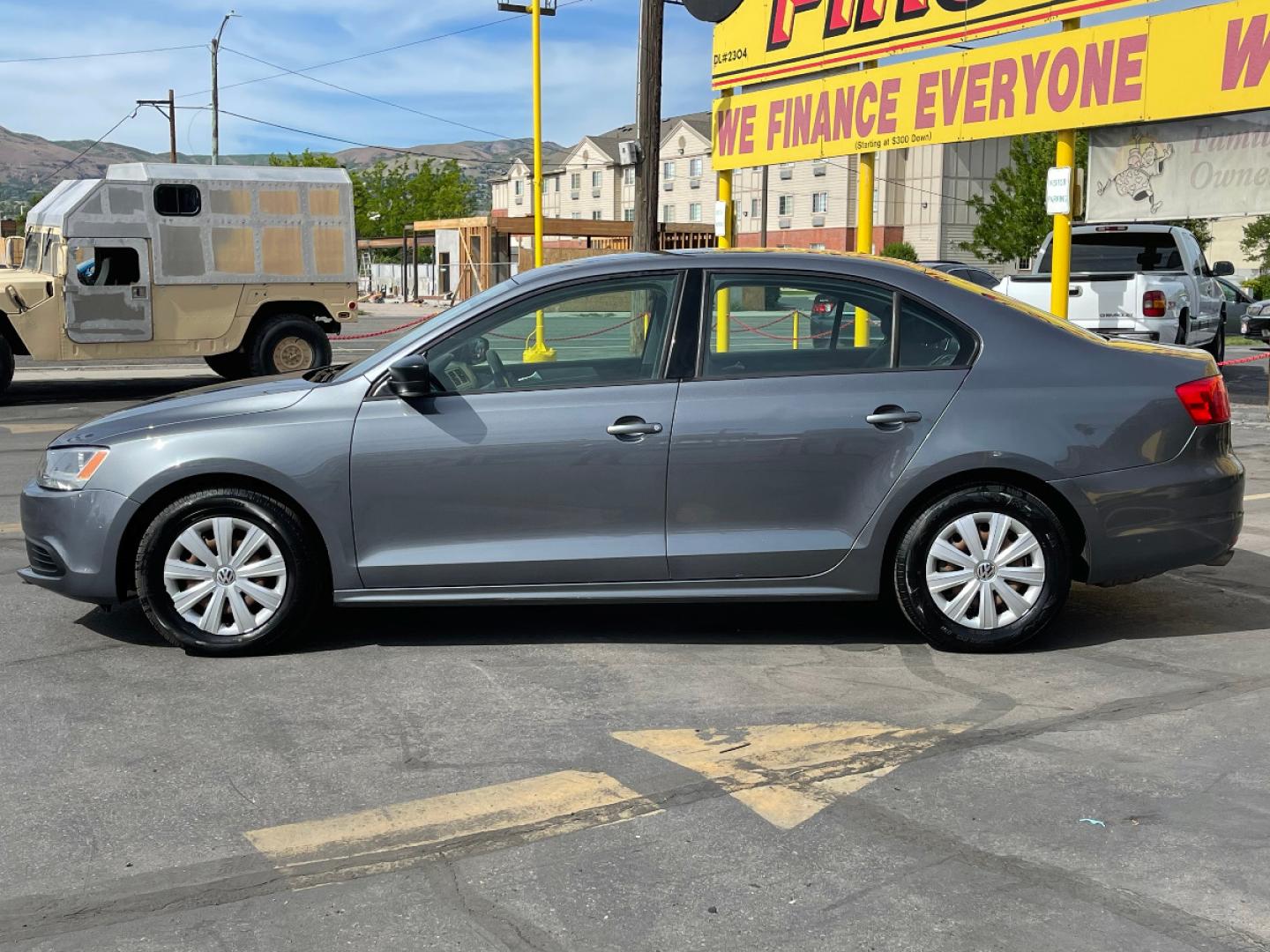 2014 Platinum Gray Metallic /Gray Cloth Volkswagen Jetta S (3VW2K7AJ7EM) with an 2.0L 4 Cyl. engine, Automatic transmission, located at 801 South State Street, Salt Lake City, UT, 84111, (801) 328-0098, 40.751953, -111.888206 - Life is crazy. Now is the time to buy! All of our prices are just dollars above our cost. These prices will change as soon as life isn't so crazy. So please call or come in. We are here to save you a lot of money! Our service department is OPEN DAILY to help with any of your service needs. P - Photo#1