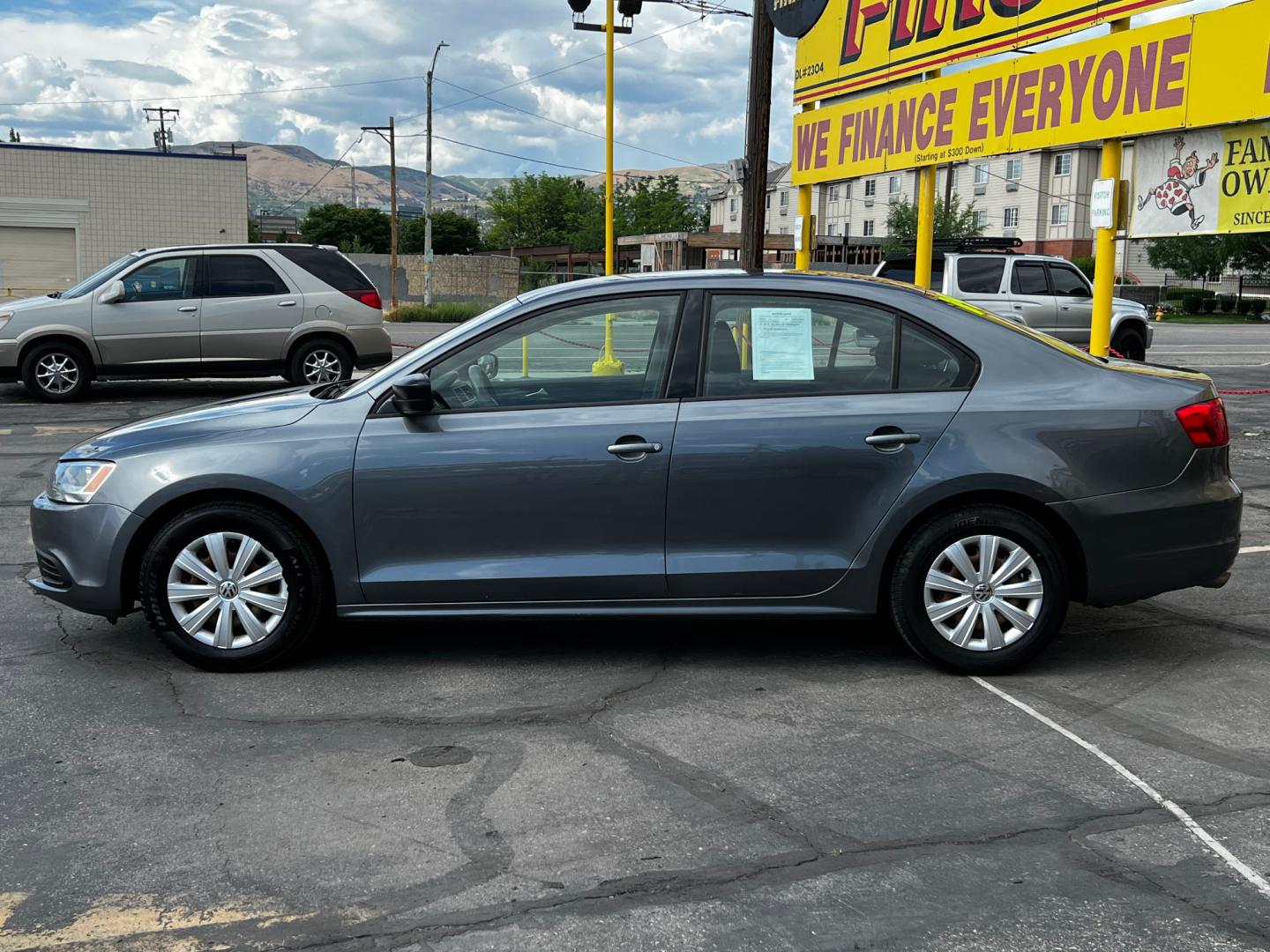 2014 Platinum Gray Metallic /Gray Cloth Volkswagen Jetta S (3VW2K7AJ7EM) with an 2.0L 4 Cyl. engine, Automatic transmission, located at 801 South State Street, Salt Lake City, UT, 84111, (801) 328-0098, 40.751953, -111.888206 - Life is crazy. Now is the time to buy! All of our prices are just dollars above our cost. These prices will change as soon as life isn't so crazy. So please call or come in. We are here to save you a lot of money! Our service department is OPEN DAILY to help with any of your service needs. P - Photo#25