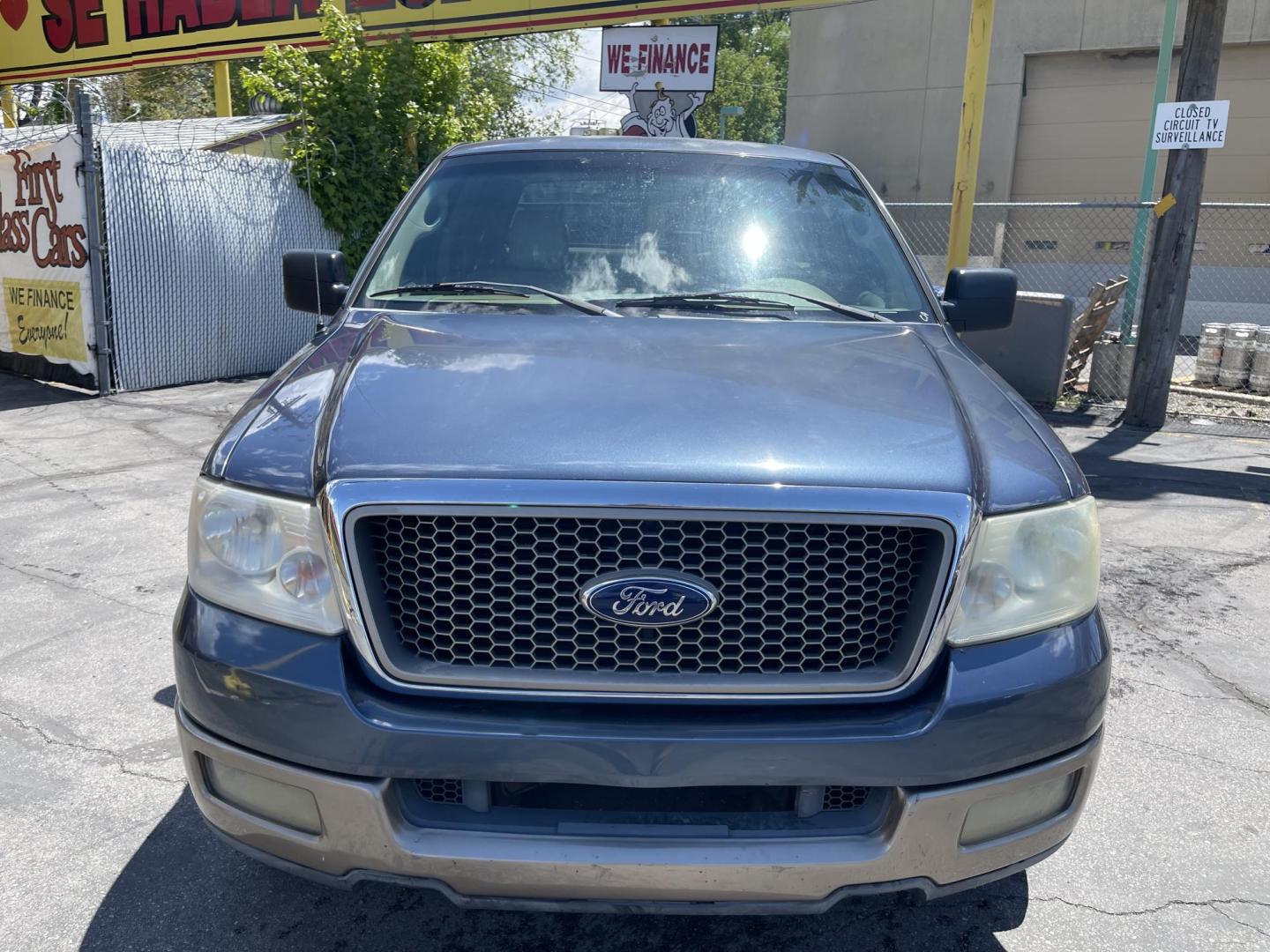 2004 True Blue Metallic /Tan Leather Ford F-150 Lariat SuperCrew (1FTPW12504K) with an 5.4L V8 engine, Automatic transmission, located at 801 South State Street, Salt Lake City, UT, 84111, (801) 328-0098, 40.751953, -111.888206 - Vehicle Features: Lariat Model, SuperCrew 4 Door, ABS Brakes, Traction Control, Cruise Control, Air Conditioning, AM/FM Stereo, CD Player, Leather Interior, Power Windows, Power Locks, Power Mirrors, Heated Seats, Power Seat(s), Privacy Glass, Tow Package, Running Boards, Alloy Wheels, Bedliner - Photo#2