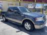 2004 True Blue Metallic /Tan Leather Ford F-150 Lariat SuperCrew (1FTPW12504K) with an 5.4L V8 engine, Automatic transmission, located at 801 South State Street, Salt Lake City, UT, 84111, (801) 328-0098, 40.751953, -111.888206 - Vehicle Features: Lariat Model, SuperCrew 4 Door, ABS Brakes, Traction Control, Cruise Control, Air Conditioning, AM/FM Stereo, CD Player, Leather Interior, Power Windows, Power Locks, Power Mirrors, Heated Seats, Power Seat(s), Privacy Glass, Tow Package, Running Boards, Alloy Wheels, Bedliner - Photo#3