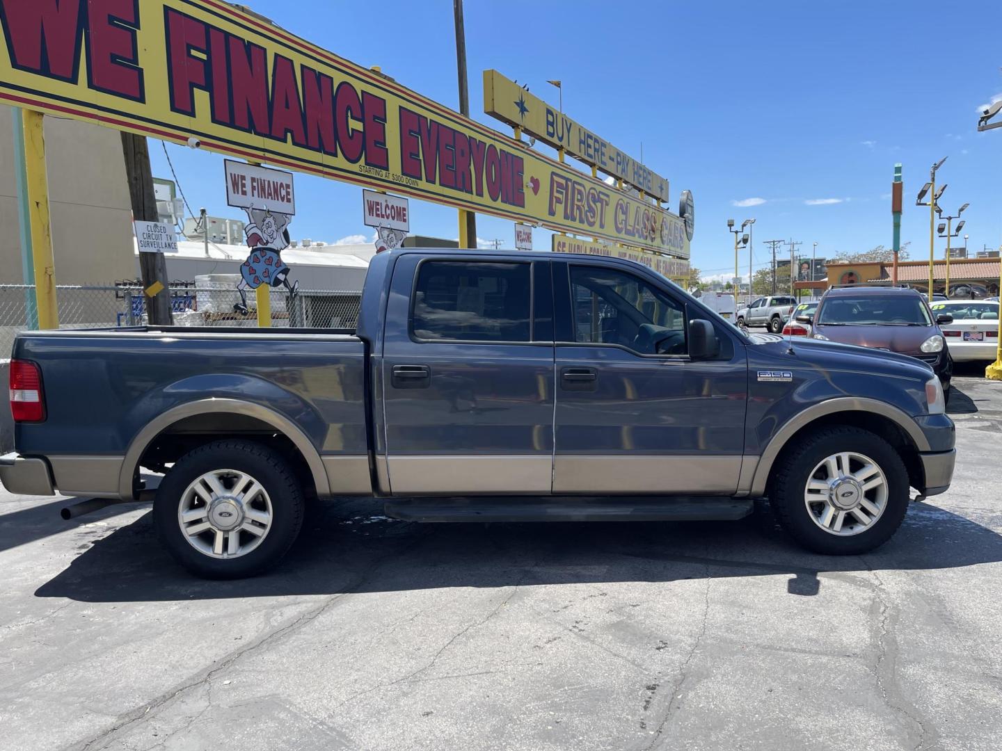 2004 True Blue Metallic /Tan Leather Ford F-150 Lariat SuperCrew (1FTPW12504K) with an 5.4L V8 engine, Automatic transmission, located at 801 South State Street, Salt Lake City, UT, 84111, (801) 328-0098, 40.751953, -111.888206 - Vehicle Features: Lariat Model, SuperCrew 4 Door, ABS Brakes, Traction Control, Cruise Control, Air Conditioning, AM/FM Stereo, CD Player, Leather Interior, Power Windows, Power Locks, Power Mirrors, Heated Seats, Power Seat(s), Privacy Glass, Tow Package, Running Boards, Alloy Wheels, Bedliner - Photo#4