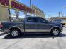 2004 True Blue Metallic /Tan Leather Ford F-150 Lariat SuperCrew (1FTPW12504K) with an 5.4L V8 engine, Automatic transmission, located at 801 South State Street, Salt Lake City, UT, 84111, (801) 328-0098, 40.751953, -111.888206 - Vehicle Features: Lariat Model, SuperCrew 4 Door, ABS Brakes, Traction Control, Cruise Control, Air Conditioning, AM/FM Stereo, CD Player, Leather Interior, Power Windows, Power Locks, Power Mirrors, Heated Seats, Power Seat(s), Privacy Glass, Tow Package, Running Boards, Alloy Wheels, Bedliner - Photo#4