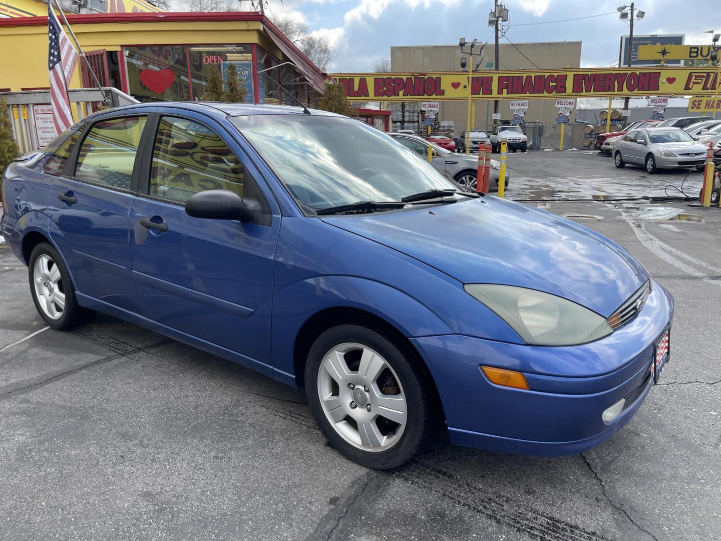 2004 French Blue Metallic /Gray Cloth Ford Focus ZTS (1FAFP38Z04W) with an 2.3L 4 Cyl. engine, Manual transmission, located at 801 South State Street, Salt Lake City, UT, 84111, (801) 328-0098, 40.751953, -111.888206 - Vehicle Features: ABS Brakes, Air Conditioning, Alloy Wheels, AM/FM Stereo, CD Audio, Cloth Seats, Cruise Control, Manual Transmission, Power Locks, Power Mirrors, Power Windows, Rear Defroster, Sunroof(s), Traction Control All advertised prices are just dollars above cost to make room for new in - Photo#3