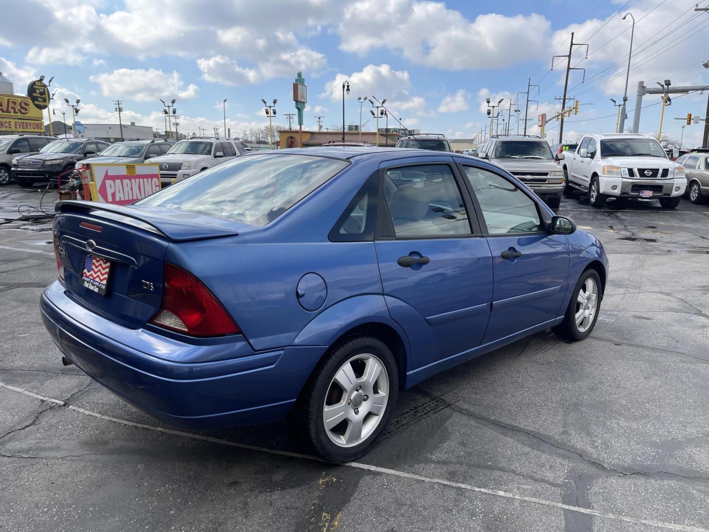 2004 French Blue Metallic /Gray Cloth Ford Focus ZTS (1FAFP38Z04W) with an 2.3L 4 Cyl. engine, Manual transmission, located at 801 South State Street, Salt Lake City, UT, 84111, (801) 328-0098, 40.751953, -111.888206 - Vehicle Features: ABS Brakes, Air Conditioning, Alloy Wheels, AM/FM Stereo, CD Audio, Cloth Seats, Cruise Control, Manual Transmission, Power Locks, Power Mirrors, Power Windows, Rear Defroster, Sunroof(s), Traction Control All advertised prices are just dollars above cost to make room for new in - Photo#5