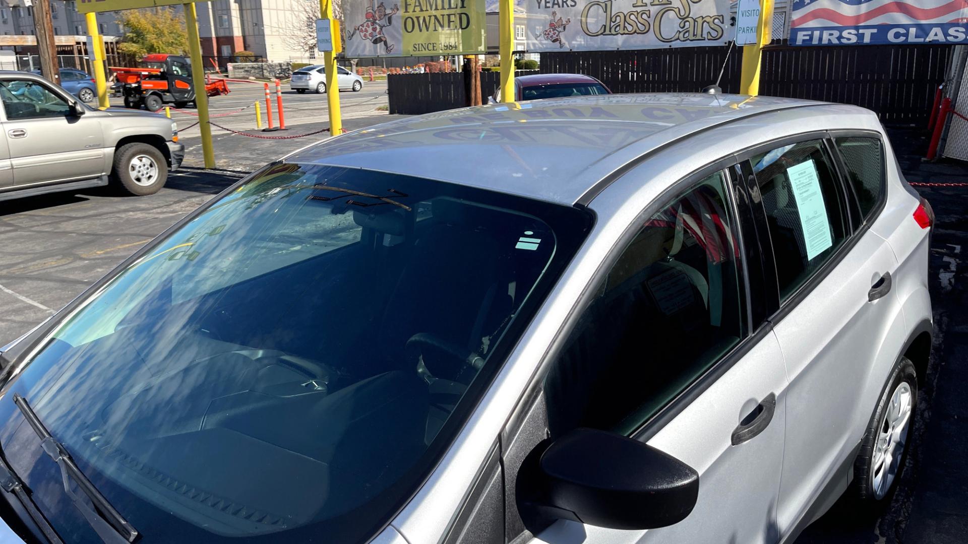 2014 Silver Sky Metallic /Black Ford Escape S (1FMCU0F75EU) with an 4 Cylinder 2.5L engine, AUTOMATIC transmission, located at 801 South State Street, Salt Lake City, UT, 84111, (801) 328-0098, 40.751953, -111.888206 - Perfect commuter car great gas mileage! FREE CAR FAX AND FREE AUTO CHECK on EVERY CAR know the car before you buy only at First Class Cars.Our service department is OPEN DAILY to help with any of your service needs. Please call for immediate appointment! Features: -ABS Brakes -AM/FM Stereo -Air C - Photo#11