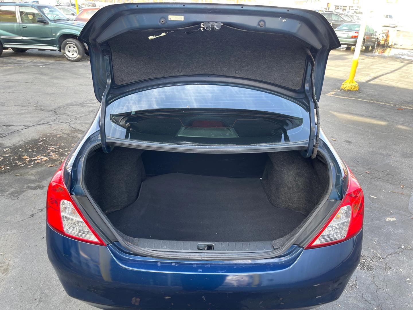 2012 Blue /Black Nissan Versa SV (3N1CN7AP9CL) with an 1.6 L 4 Cylinder engine, AUTOMATIC transmission, located at 801 South State Street, Salt Lake City, UT, 84111, (801) 328-0098, 40.751953, -111.888206 - Features: ABS Brakes, AM/FM Stereo, Air Conditioning, Automatic Transmission, Auxiliary Audio Input, Bluetooth Technology, CD Audio, Cloth Seats, Cruise Control, Overhead Airbags, Power Locks, Power Mirrors, Power Windows, Rear Defroster, Side Airbags, Traction Control Discover affordable reliabili - Photo#12