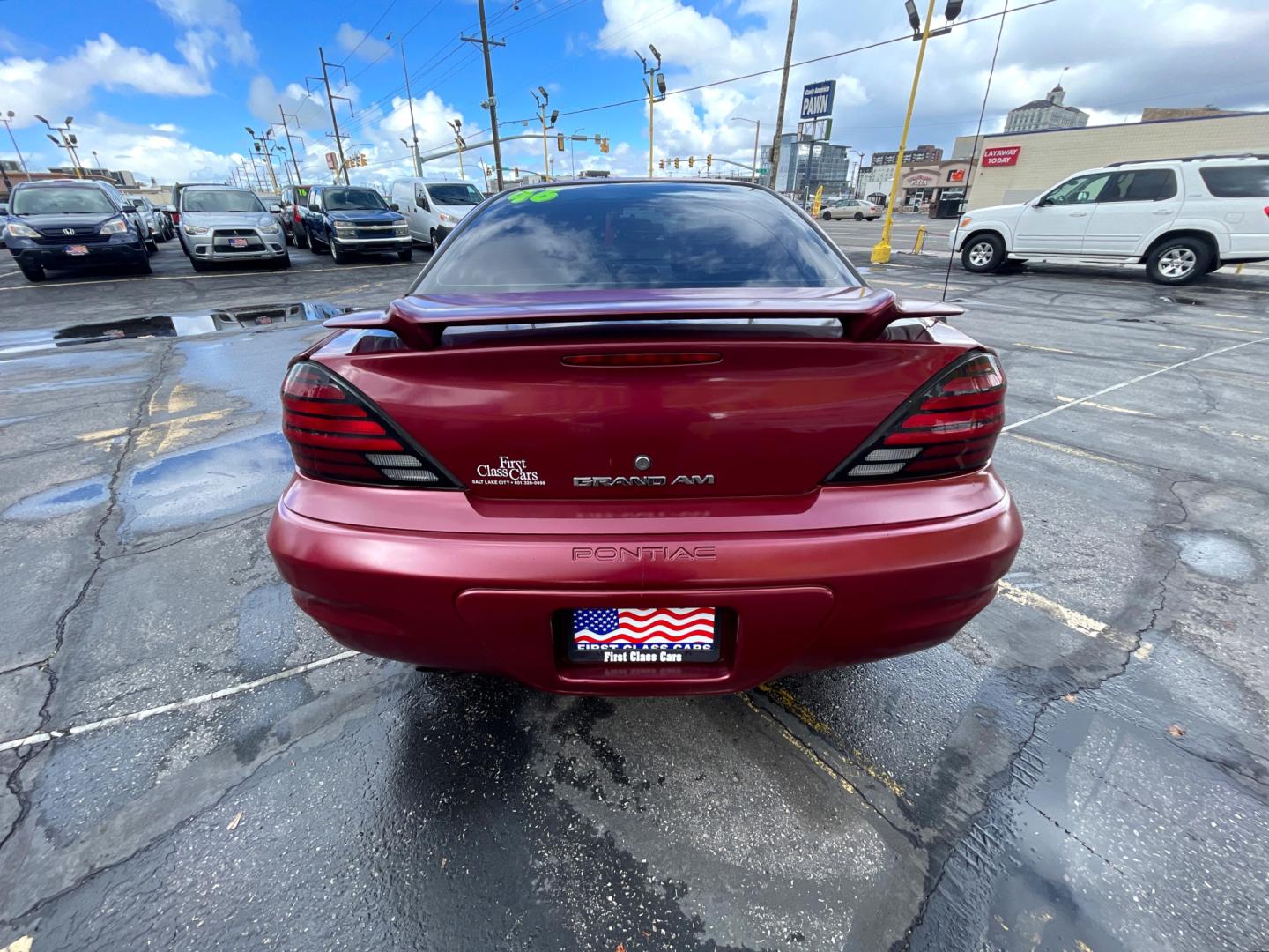 2004 Salsa Red Pearl /Gray Pontiac Grand AM SE (1G2NF52E74M) with an 3.4Liter V6 engine, Automatic transmission, located at 801 South State Street, Salt Lake City, UT, 84111, (801) 328-0098, 40.751953, -111.888206 - Top Features: Alloy Wheels, Cloth Seats, ABS Brakes, CD Audio, Power Seat(s), Traction Control, AM/FM Stereo, Cruise Control, Power Windows, Air Conditioning, Power Locks, Rear Defroster, Automatic Transmission, Power Mirrors, Rear Spoiler - Photo#4