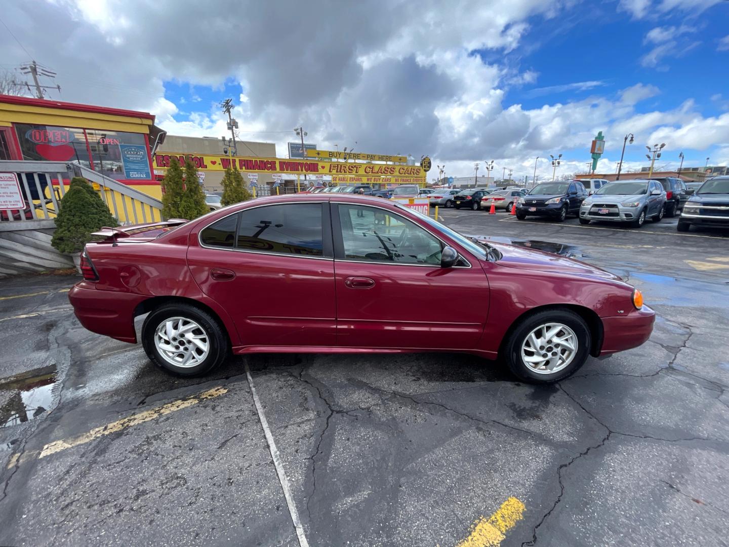 2004 Salsa Red Pearl /Gray Pontiac Grand AM SE (1G2NF52E74M) with an 3.4Liter V6 engine, Automatic transmission, located at 801 South State Street, Salt Lake City, UT, 84111, (801) 328-0098, 40.751953, -111.888206 - Top Features: Alloy Wheels, Cloth Seats, ABS Brakes, CD Audio, Power Seat(s), Traction Control, AM/FM Stereo, Cruise Control, Power Windows, Air Conditioning, Power Locks, Rear Defroster, Automatic Transmission, Power Mirrors, Rear Spoiler - Photo#2