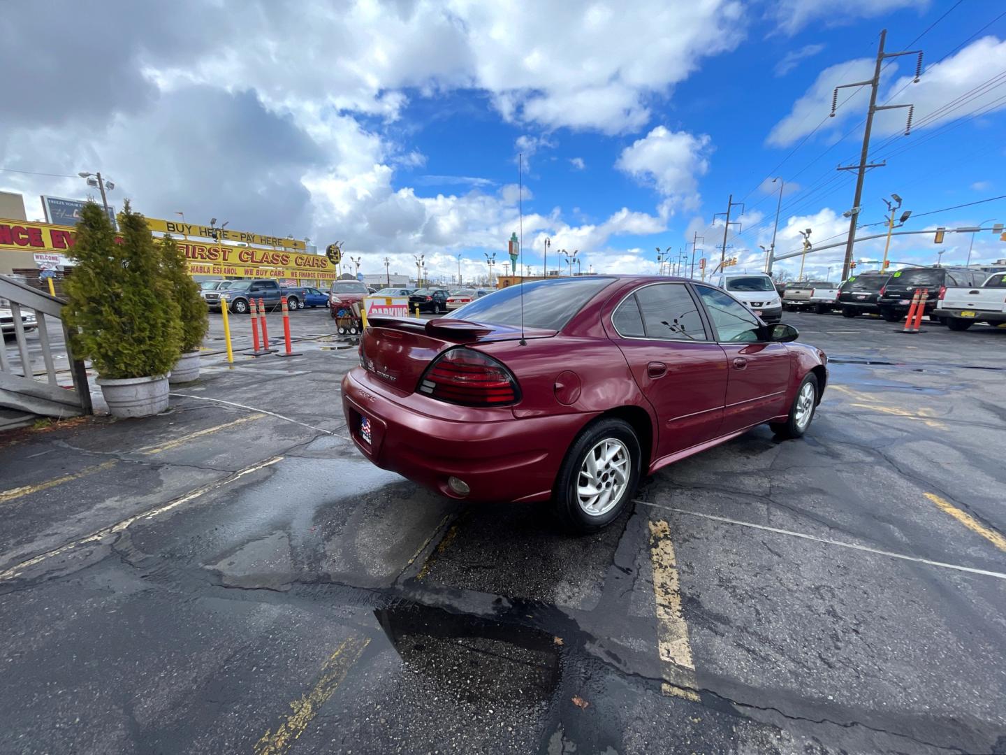 2004 Salsa Red Pearl /Gray Pontiac Grand AM SE (1G2NF52E74M) with an 3.4Liter V6 engine, Automatic transmission, located at 801 South State Street, Salt Lake City, UT, 84111, (801) 328-0098, 40.751953, -111.888206 - Top Features: Alloy Wheels, Cloth Seats, ABS Brakes, CD Audio, Power Seat(s), Traction Control, AM/FM Stereo, Cruise Control, Power Windows, Air Conditioning, Power Locks, Rear Defroster, Automatic Transmission, Power Mirrors, Rear Spoiler - Photo#3