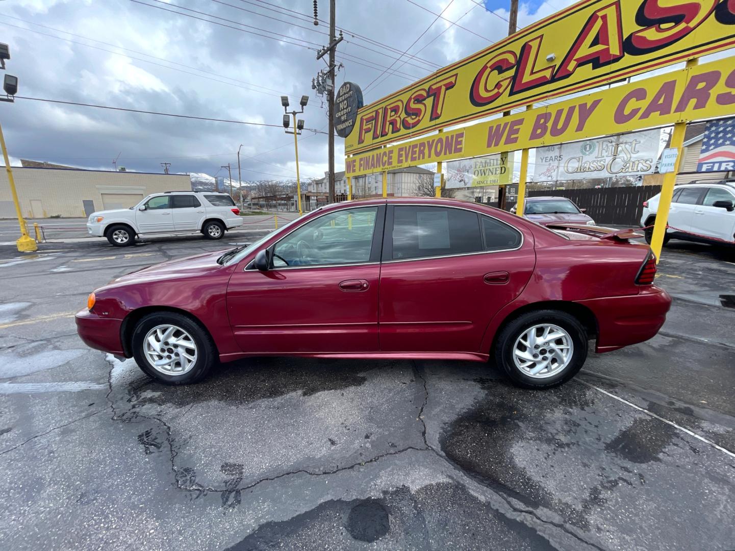 2004 Salsa Red Pearl /Gray Pontiac Grand AM SE (1G2NF52E74M) with an 3.4Liter V6 engine, Automatic transmission, located at 801 South State Street, Salt Lake City, UT, 84111, (801) 328-0098, 40.751953, -111.888206 - Top Features: Alloy Wheels, Cloth Seats, ABS Brakes, CD Audio, Power Seat(s), Traction Control, AM/FM Stereo, Cruise Control, Power Windows, Air Conditioning, Power Locks, Rear Defroster, Automatic Transmission, Power Mirrors, Rear Spoiler - Photo#6