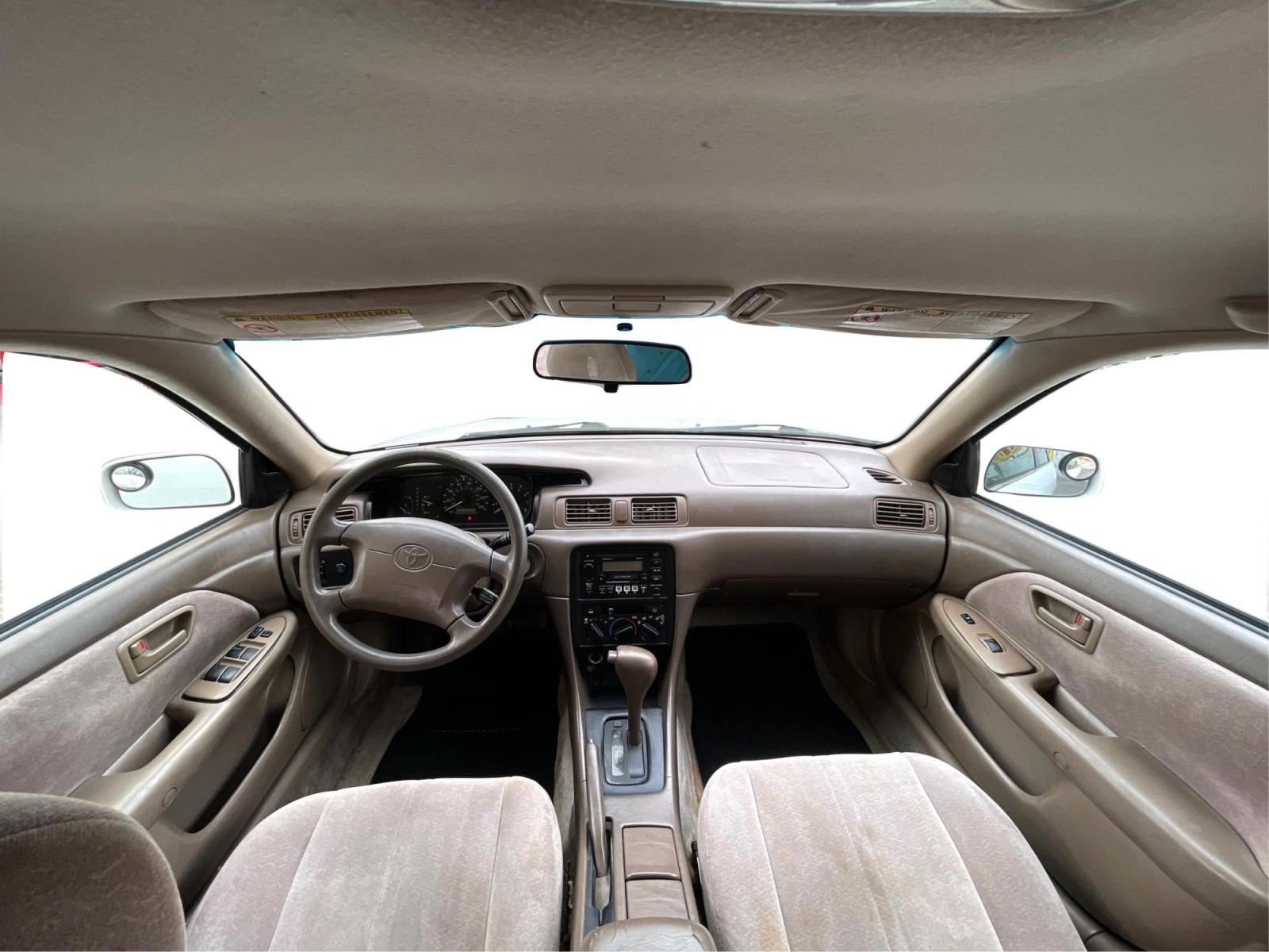1999 Pure White /Tan Toyota Camry LE (JT2BG28KXX0) with an 2.2Liter 4 Cylinder engine, Automatic transmission, located at 801 South State Street, Salt Lake City, UT, 84111, (801) 328-0098, 40.751953, -111.888206 - Top Features:Cloth Seats, ABS Brakes, CD Audio, Power Mirrors, Side Airbags, AM/FM Stereo, Cassette Player, Power Seat(s), Air Conditioning, Cruise Control, Power Windows, Automatic Transmission, Power Locks, Rear Defroster "Experience unbeatable reliability with this 1999 used Toyota Camry. Boas - Photo #20