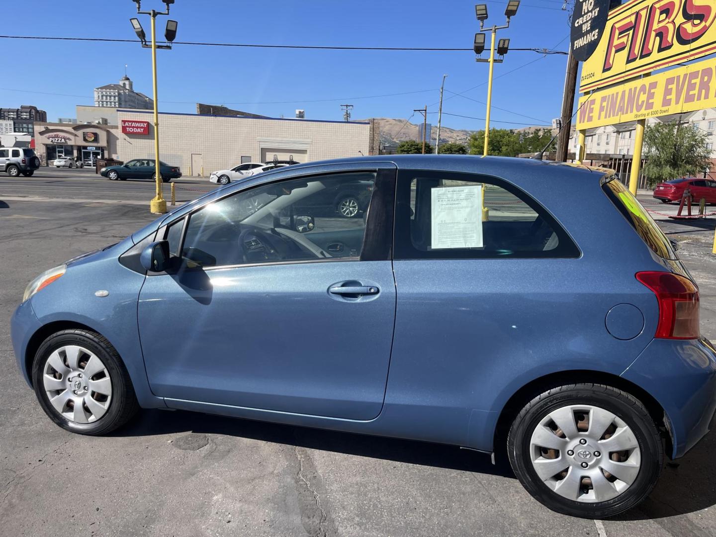 2008 Blue /Tan Toyota Yaris Liftback (JTDJT923785) with an 1.5L L4 DOHC 16V engine, Manual transmission, located at 801 South State Street, Salt Lake City, UT, 84111, (801) 328-0098, 40.751953, -111.888206 - Clean 1 owner! Clean title! Great gas mileage gets over 35-40 MPG with a manual transmission and 1.5 liter 4 cylinder! Perfect commuter car for anyone who drives to work over 20-50 miles! This is a perfect car to travel on long distance trips to save gas money! Features: Cloth Seats, AM/FM Stereo, - Photo#9