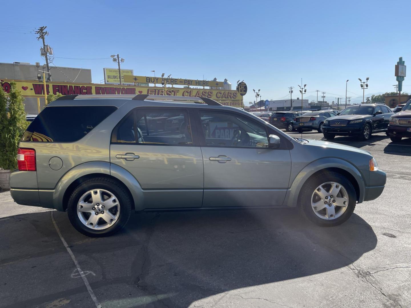 2005 Evergreen Frost Metallic /Tan Ford Freestyle Limited AWD (1FMDK06105G) with an 3.0L V6 DOHC 24V engine, Automatic CVT Overdrive transmission, located at 801 South State Street, Salt Lake City, UT, 84111, (801) 328-0098, 40.751953, -111.888206 - Clean title no reported accidents on Carfax history report. Very nice in great condition for the year and miles. It is in great shape inside and out! Features: 4WD/AWD, Memory Seat(s), Alloy Wheels, Parking Sensors, Fold-Away Third Row, Sunroof(s), Front Seat Heaters,Third Row Seat, Leather Seats, - Photo#5