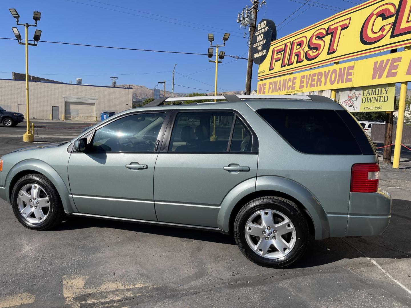 2005 Evergreen Frost Metallic /Tan Ford Freestyle Limited AWD (1FMDK06105G) with an 3.0L V6 DOHC 24V engine, Automatic CVT Overdrive transmission, located at 801 South State Street, Salt Lake City, UT, 84111, (801) 328-0098, 40.751953, -111.888206 - Clean title no reported accidents on Carfax history report. Very nice in great condition for the year and miles. It is in great shape inside and out! Features: 4WD/AWD, Memory Seat(s), Alloy Wheels, Parking Sensors, Fold-Away Third Row, Sunroof(s), Front Seat Heaters,Third Row Seat, Leather Seats, - Photo#8