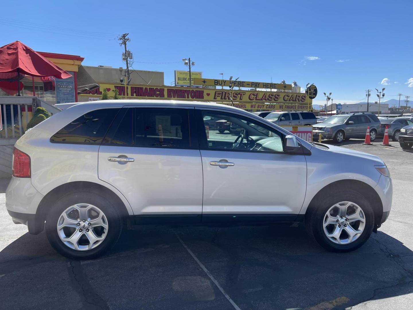 2011 Satin Silver Metallic /Black Ford Edge SEL FWD (2FMDK3JC2BB) with an 3.5L V6 DOHC 24V engine, 6-Speed Automatic transmission, located at 801 South State Street, Salt Lake City, UT, 84111, (801) 328-0098, 40.751953, -111.888206 - Clean Carfax no reported accidents on Carfax! Nice SUV! Features: Alloy Wheels, Parking Sensors, Bluetooth Technology, Satellite Radio Ready, Cloth Seats, SiriusXM Trial Available, ABS Brakes, Auxiliary Audio Input, Power Locks, Rear Defroster, AM/FM Stereo, CD Audio, Power Mirrors, Side Airbags, - Photo#6