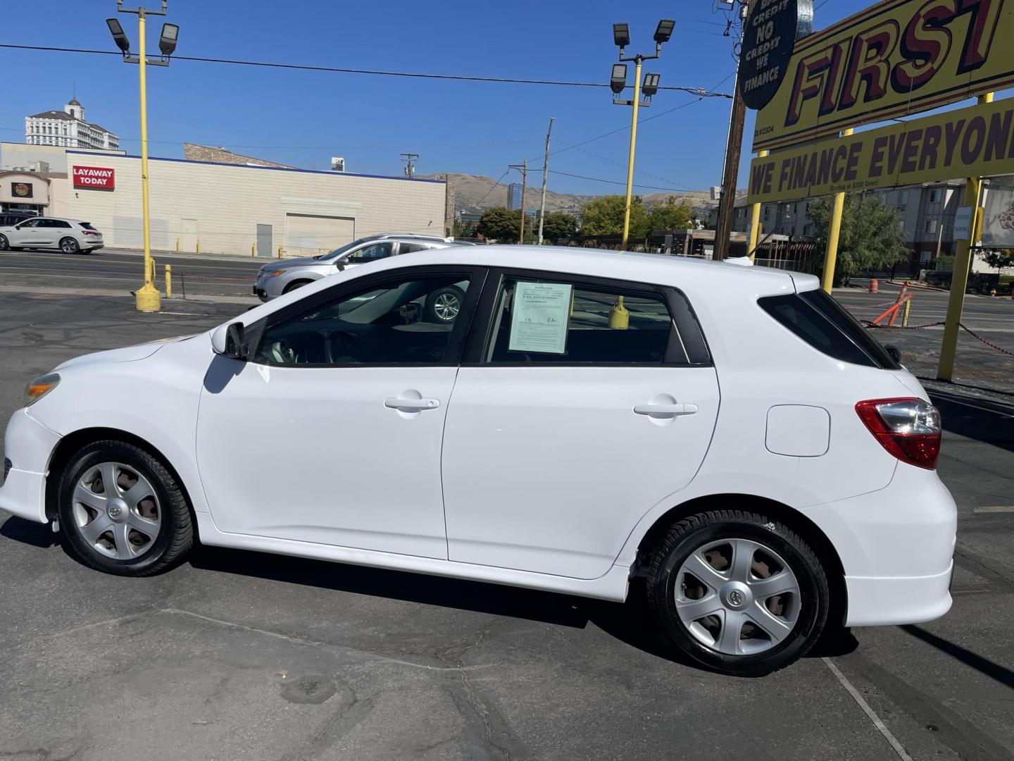 2009 Galaxy White /Black Toyota Matrix S 5-Speed AT (2T1KE40E69C) with an 2.4L L4 engine, Automatic with Overdrive transmission, located at 801 South State Street, Salt Lake City, UT, 84111, (801) 328-0098, 40.751953, -111.888206 - Clean title! No reported accidents on the Carfax vehicle history report! Great gas saver! 26 mpg city and 32 mpg highway!!! Great commuter must see!!! Features: Cloth Seats, ABS Brakes, Auxiliary Audio Input, Power Locks, Side Airbags, AM/FM Stereo, CD Audio, Power Mirrors, Air Conditioning, Cruise - Photo#8