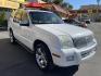 2010 Galaxy White /Tan Mercury Mountaineer Premier 4.6L AWD (4M2EN4J84AU) with an 4.6L V8 SOHC 12V engine, 6-Speed Automatic Overdrive transmission, located at 801 South State Street, Salt Lake City, UT, 84111, (801) 328-0098, 40.751953, -111.888206 - Clean title no reported accidents on Carfax history report!!! Very nice all wheel drive SUV for winter! In great condition for the year, make and miles!!! 3rd Row seating, Navigation and leather seats loaded with lots of extras! Must see very clean SUV. Features: 20 Inch Plus Wheels, Parking Senso - Photo#3