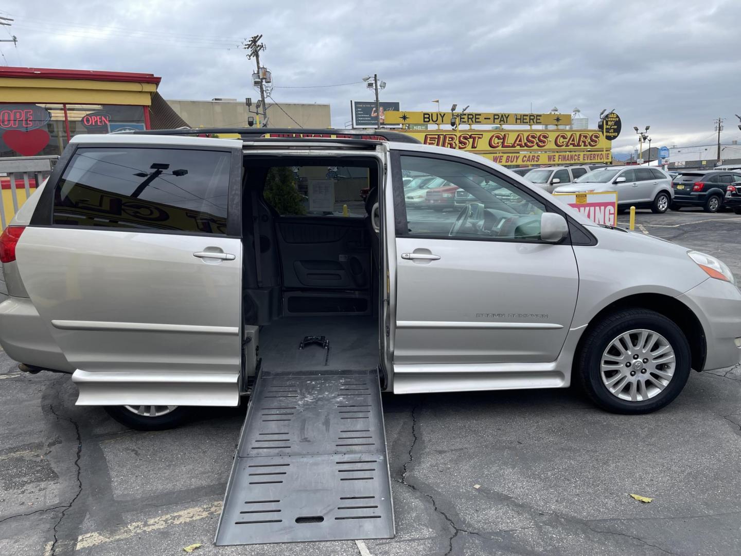 2009 Silver Sky Metallic /Tan Toyota Sienna XLE BraunAbility (5TDZK22C59S) with an 3.5L V6 EFI DOHC 24V engine, 5-Speed Automatic transmission, located at 801 South State Street, Salt Lake City, UT, 84111, (801) 328-0098, 40.751953, -111.888206 - Equipped with BraunAbility motorized wheelchair ramp. Great van in good shape for anyone who needs a handicap accessible van. No middle row seating for the wheelchair ramp. The BraunAbility wheelchair ramp is over $10,000 if you purchase the ramp separately from a BraunAbility dealer not including t - Photo#2