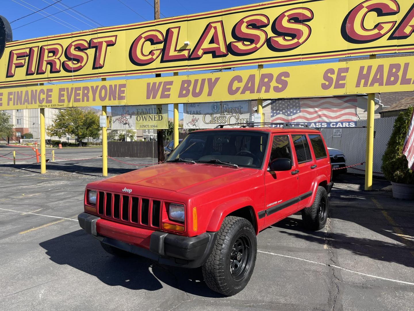 1999 Rallye Red /Black Jeep Cherokee Sport 4-Door 4WD (1J4FF68S3XL) with an 4.0L L6 OHV 12V engine, Automatic transmission, located at 801 South State Street, Salt Lake City, UT, 84111, (801) 328-0098, 40.751953, -111.888206 - Clean 1999 Jeep Cherokee Sport 4x4! Clean title! Only 3 previous owners reported on the Carfax history report. Features: Automatic, 4x4, 4 Door, Tow package, Am/FM/CD, Roof Rack, 4.0L 6 cylinder, cloth seats, power windows, power locks, power steering, rear wiper. - Photo#0