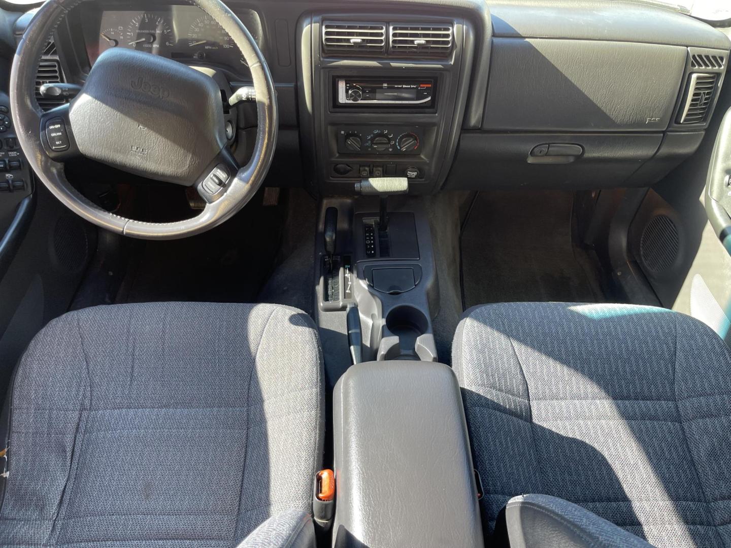 1999 Rallye Red /Black Jeep Cherokee Sport 4-Door 4WD (1J4FF68S3XL) with an 4.0L L6 OHV 12V engine, Automatic transmission, located at 801 South State Street, Salt Lake City, UT, 84111, (801) 328-0098, 40.751953, -111.888206 - Clean 1999 Jeep Cherokee Sport 4x4! Clean title! Only 3 previous owners reported on the Carfax history report. Features: Automatic, 4x4, 4 Door, Tow package, Am/FM/CD, Roof Rack, 4.0L 6 cylinder, cloth seats, power windows, power locks, power steering, rear wiper. - Photo#11