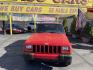 1999 Rallye Red /Black Jeep Cherokee Sport 4-Door 4WD (1J4FF68S3XL) with an 4.0L L6 OHV 12V engine, Automatic transmission, located at 801 South State Street, Salt Lake City, UT, 84111, (801) 328-0098, 40.751953, -111.888206 - Clean 1999 Jeep Cherokee Sport 4x4! Clean title! Only 3 previous owners reported on the Carfax history report. Features: Automatic, 4x4, 4 Door, Tow package, Am/FM/CD, Roof Rack, 4.0L 6 cylinder, cloth seats, power windows, power locks, power steering, rear wiper. - Photo#1