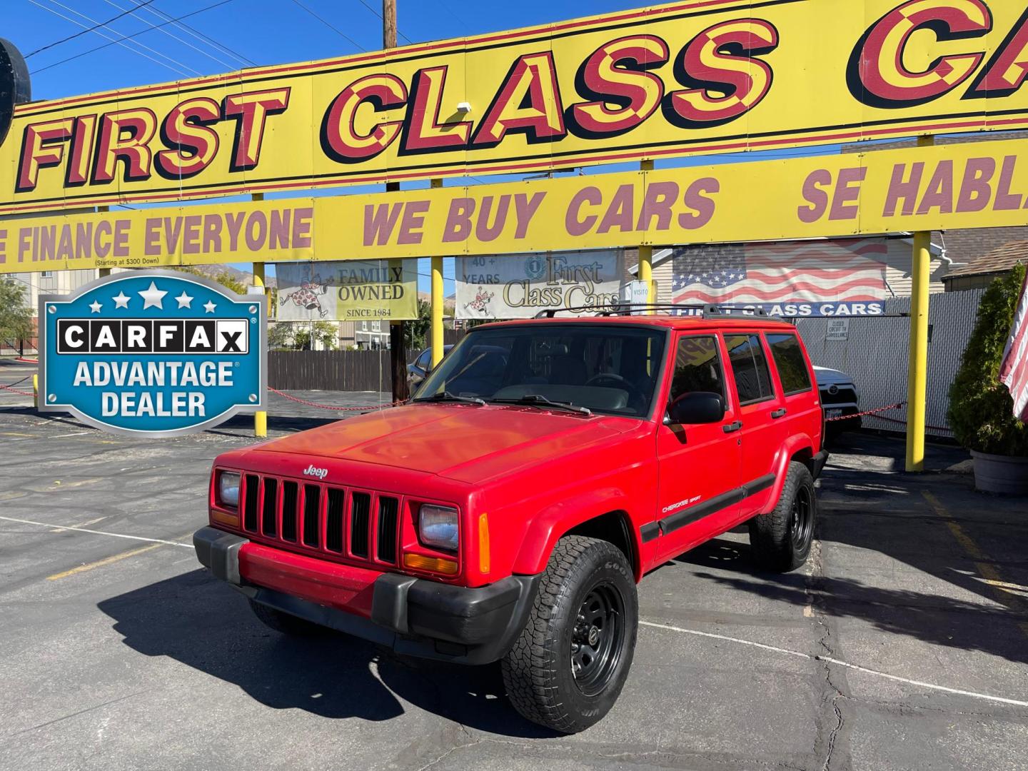 1999 Rallye Red /Black Jeep Cherokee Sport 4-Door 4WD (1J4FF68S3XL) with an 4.0L L6 OHV 12V engine, Automatic transmission, located at 801 South State Street, Salt Lake City, UT, 84111, (801) 328-0098, 40.751953, -111.888206 - Clean 1999 Jeep Cherokee Sport 4x4! Clean title! Only 3 previous owners reported on the Carfax history report. Features: Automatic, 4x4, 4 Door, Tow package, Am/FM/CD, Roof Rack, 4.0L 6 cylinder, cloth seats, power windows, power locks, power steering, rear wiper. - Photo#0