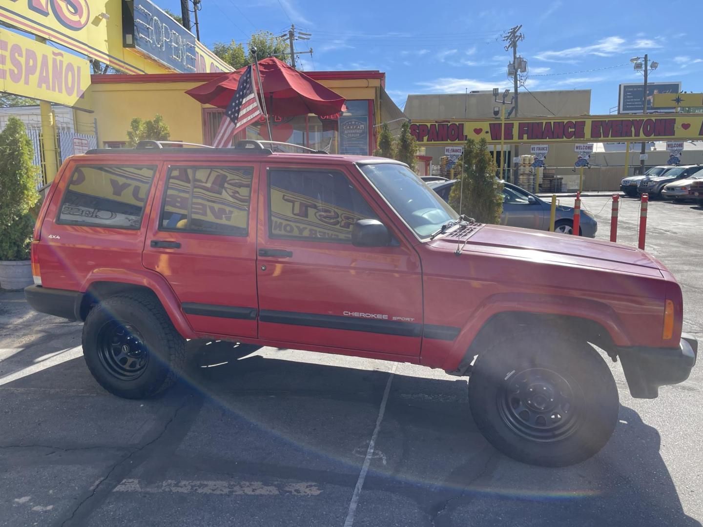 1999 Rallye Red /Black Jeep Cherokee Sport 4-Door 4WD (1J4FF68S3XL) with an 4.0L L6 OHV 12V engine, Automatic transmission, located at 801 South State Street, Salt Lake City, UT, 84111, (801) 328-0098, 40.751953, -111.888206 - Clean 1999 Jeep Cherokee Sport 4x4! Clean title! Only 3 previous owners reported on the Carfax history report. Features: Automatic, 4x4, 4 Door, Tow package, Am/FM/CD, Roof Rack, 4.0L 6 cylinder, cloth seats, power windows, power locks, power steering, rear wiper. - Photo#3