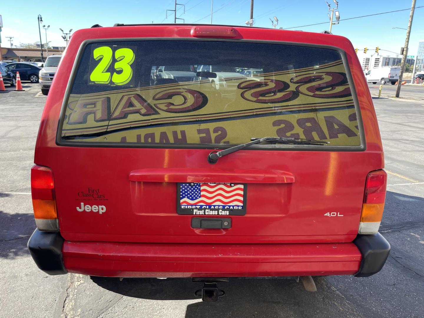 1999 Rallye Red /Black Jeep Cherokee Sport 4-Door 4WD (1J4FF68S3XL) with an 4.0L L6 OHV 12V engine, Automatic transmission, located at 801 South State Street, Salt Lake City, UT, 84111, (801) 328-0098, 40.751953, -111.888206 - Clean 1999 Jeep Cherokee Sport 4x4! Clean title! Only 3 previous owners reported on the Carfax history report. Features: Automatic, 4x4, 4 Door, Tow package, Am/FM/CD, Roof Rack, 4.0L 6 cylinder, cloth seats, power windows, power locks, power steering, rear wiper. - Photo#5