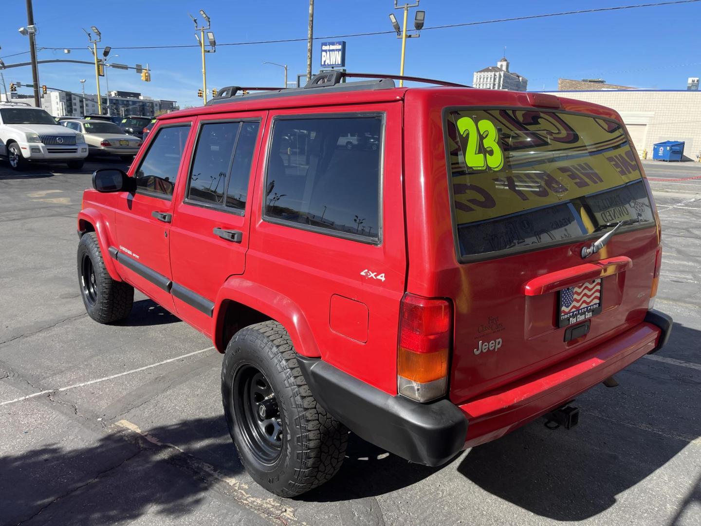 1999 Rallye Red /Black Jeep Cherokee Sport 4-Door 4WD (1J4FF68S3XL) with an 4.0L L6 OHV 12V engine, Automatic transmission, located at 801 South State Street, Salt Lake City, UT, 84111, (801) 328-0098, 40.751953, -111.888206 - Clean 1999 Jeep Cherokee Sport 4x4! Clean title! Only 3 previous owners reported on the Carfax history report. Features: Automatic, 4x4, 4 Door, Tow package, Am/FM/CD, Roof Rack, 4.0L 6 cylinder, cloth seats, power windows, power locks, power steering, rear wiper. - Photo#6