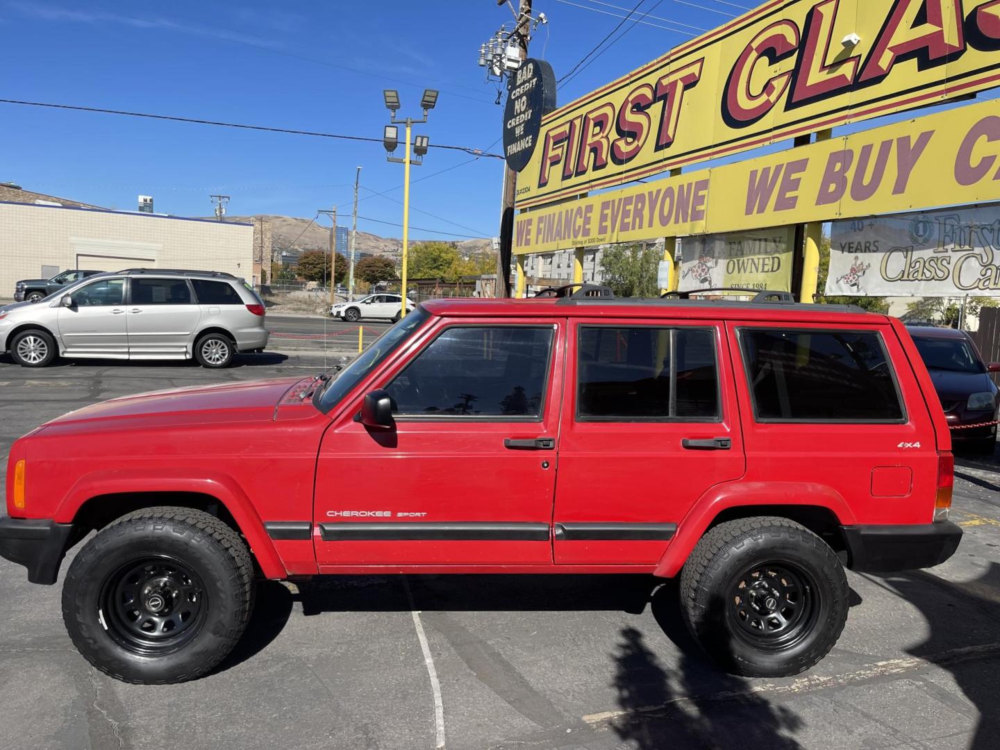 1999 Rallye Red /Black Jeep Cherokee Sport 4-Door 4WD (1J4FF68S3XL) with an 4.0L L6 OHV 12V engine, Automatic transmission, located at 801 South State Street, Salt Lake City, UT, 84111, (801) 328-0098, 40.751953, -111.888206 - Clean 1999 Jeep Cherokee Sport 4x4! Clean title! Only 3 previous owners reported on the Carfax history report. Features: Automatic, 4x4, 4 Door, Tow package, Am/FM/CD, Roof Rack, 4.0L 6 cylinder, cloth seats, power windows, power locks, power steering, rear wiper. - Photo#7