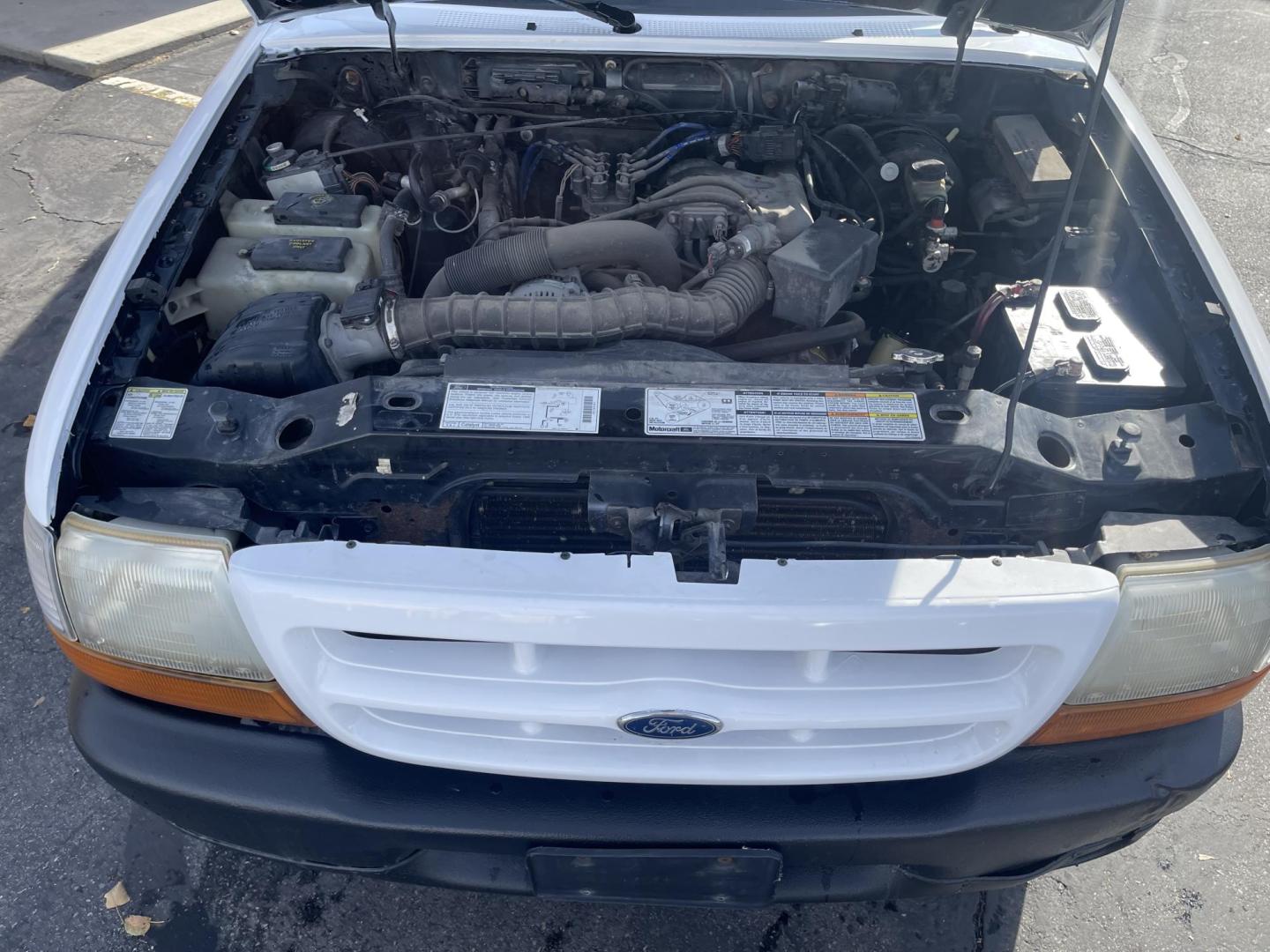 1999 Artic White /Gray Ford Ranger XL Reg. Cab Long Bed (1FTYR10V4XP) with an 3.0L V6 OHV 12V FFV engine, Automatic transmission, located at 801 South State Street, Salt Lake City, UT, 84111, (801) 328-0098, 40.751953, -111.888206 - Hard to find small fuel efficient truck! In great running condition for the year, make and miles! New bed liner has been sprayed in the bed! Clean truck in good running condition! Perfect for anyone looking to run a small business and need a truck for multiple needs. Features: 4 cylinder 3.0 liter - Photo#12