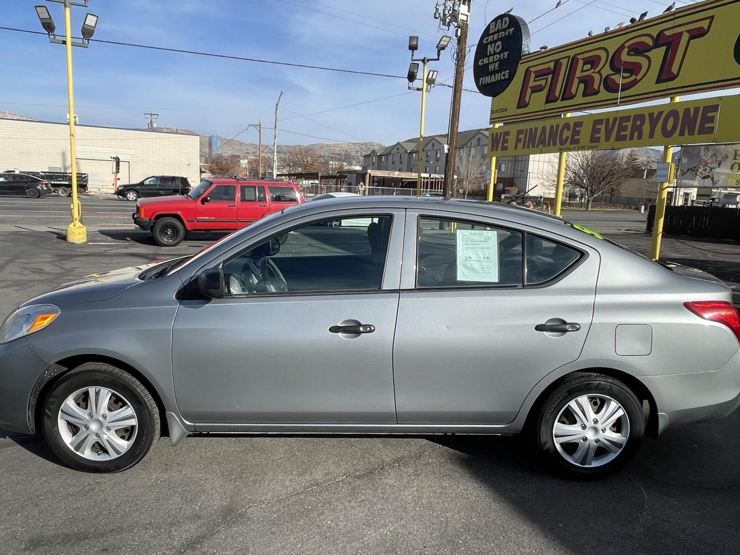 2012 Platinum Gray Metallic /Black Nissan Versa 1.6 S Sedan (3N1CN7AP2CL) with an 1.6L L4 DOHC 16V engine, 5-Speed Manual transmission, located at 801 South State Street, Salt Lake City, UT, 84111, (801) 328-0098, 40.751953, -111.888206 - One owner clean title! No accidents on Carfax history report! From a dry climate area in Arizona has not been in the Utah snow yet! Great gas mileage the fuel economy is 24 mpg in the city and up to 32 mpg on the highway. Features: Cloth Seats, ABS Brakes, Automatic Transmission, Overhead Airbags, - Photo#9