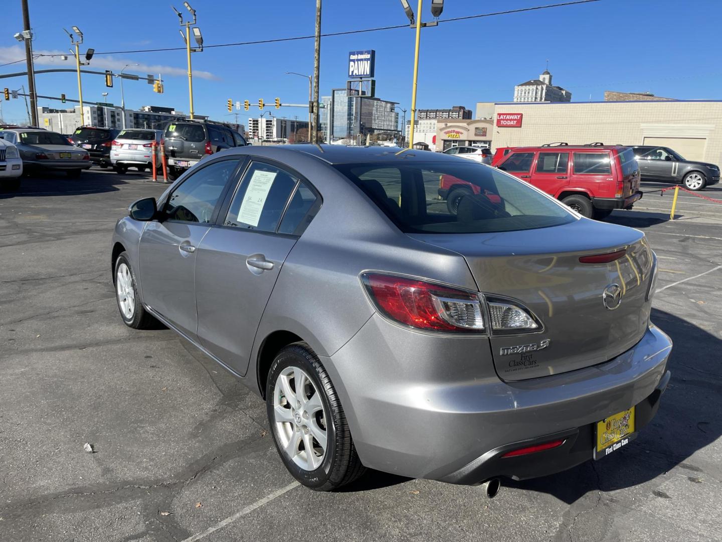 2011 Silver Sky Metallic /Black Mazda MAZDA3 i Touring 4-Door (JM1BL1VG1B1) with an 2.0L L4 DOHC 16V engine, Automatic transmission, located at 801 South State Street, Salt Lake City, UT, 84111, (801) 328-0098, 40.751953, -111.888206 - Car has New Tires! Carfax 1 owner car! Clean title no accidents in great condition for the year and miles! Hard to find, great on gas 25 city highway mpg 32 average gas mileage combined around 27 MPG! Must see for anyone looking for a clean reliable Mazda 3!!!! Features: Alloy Wheels, Bluetooth T - Photo#6