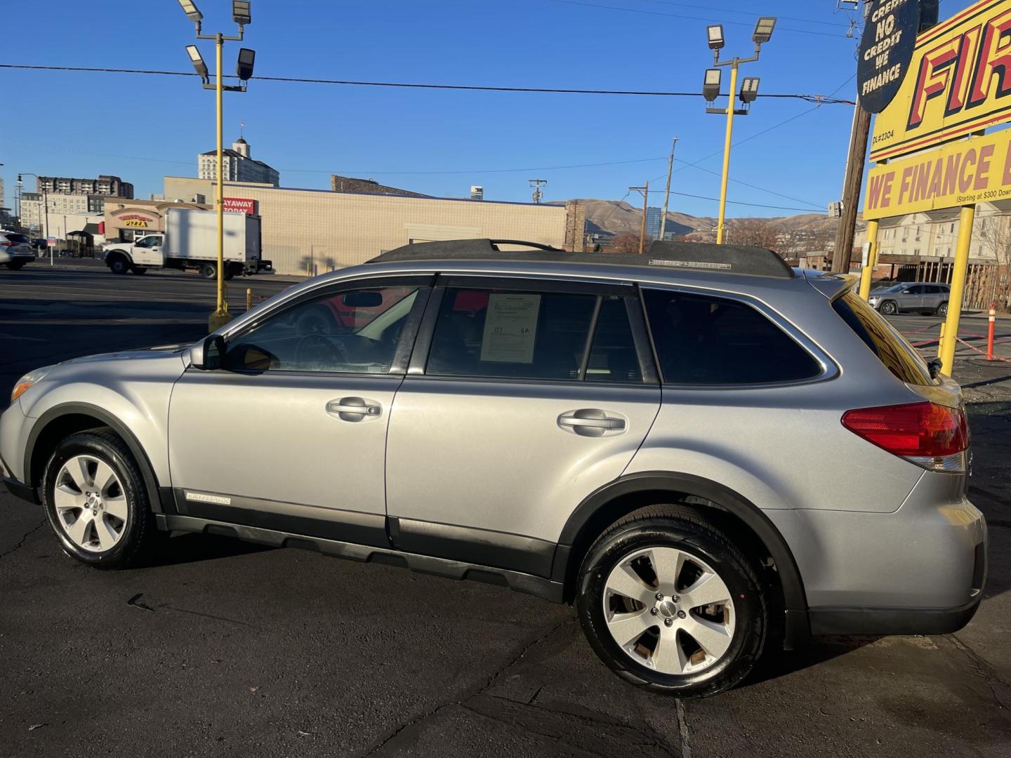 2012 Quick Silver Pearl /Black Subaru Outback 2.5i Premium (4S4BRBGCXC3) with an 2.5L H4 DOHC 16V engine, Automatic transmission, located at 801 South State Street, Salt Lake City, UT, 84111, (801) 328-0098, 40.751953, -111.888206 - New tires! Clean title! Clean Carfax only 2 owners no accidents! Perfect AWD vehicle for winter time! Great gas mileage! Must see for anyone looking for a nice affordable reliable car with AWD! Features: 4WD/AWD, Cloth Seats, Alloy Wheels, Front Seat Heaters, Bluetooth Technology, Tow Hitch, ABS B - Photo#8