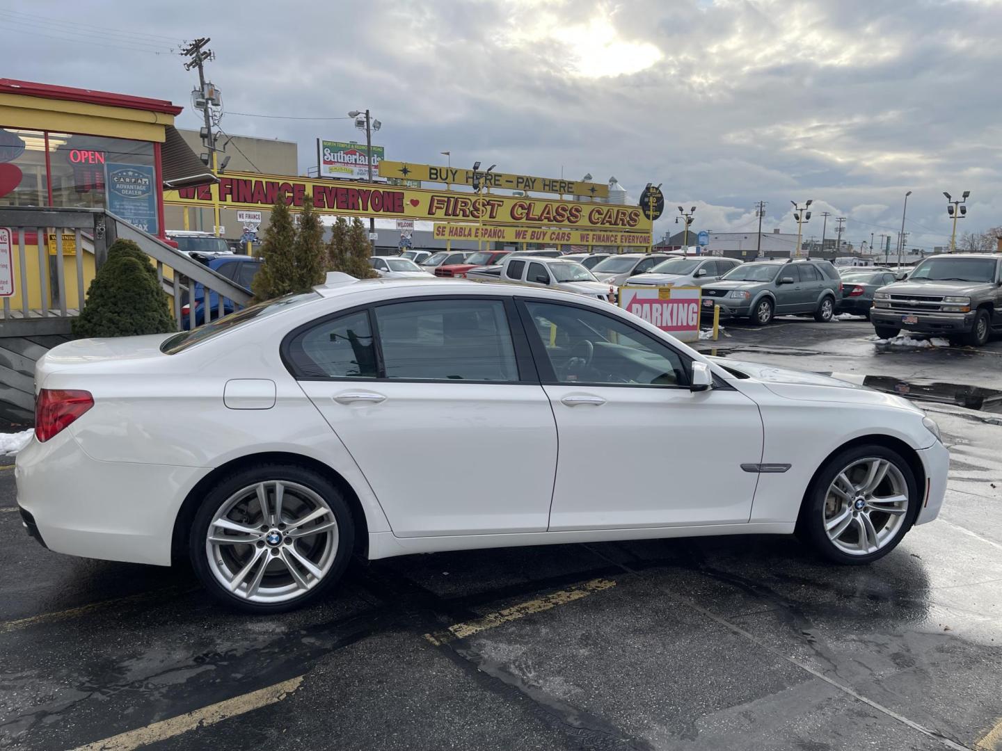 2012 Artic White /Black BMW 7-Series 750i (WBAKA8C57CC) with an 4.8L V8 DOHC 32V engine, 6-Speed Automatic transmission, located at 801 South State Street, Salt Lake City, UT, 84111, (801) 328-0098, 40.751953, -111.888206 - Wow low miles! Clean inside and out immaculate condition!!! Clean title! Runs great! Nice black leather interior in excellent shape for the year make and miles!!! Features: 20 Inch Plus Wheels, Navigation System, A/C Seat(s), Parking Sensors, Alloy Wheels, Power Hatch/Deck Lid, Automated Cruise Con - Photo#7