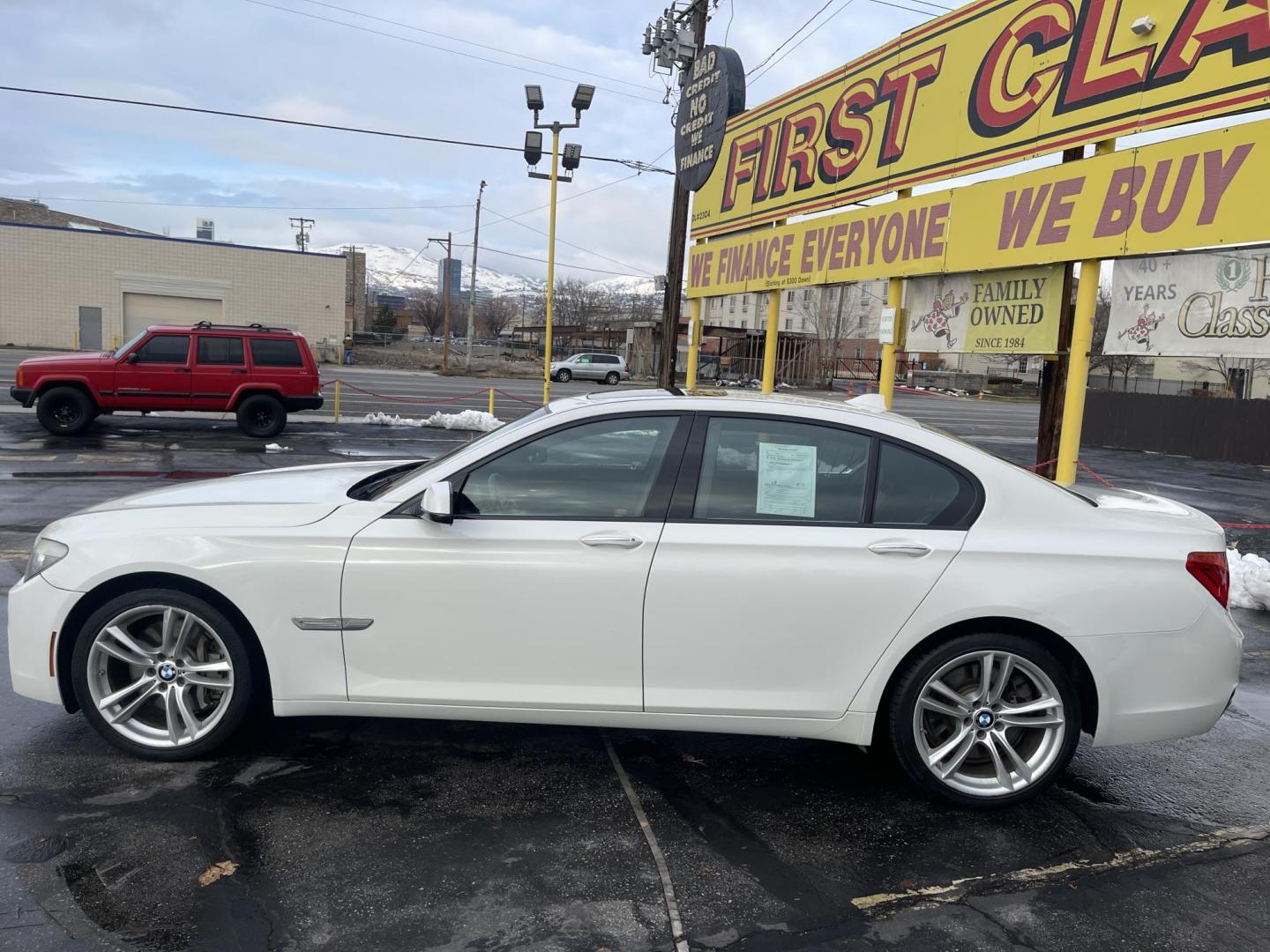 2012 Artic White /Black BMW 7-Series 750i (WBAKA8C57CC) with an 4.8L V8 DOHC 32V engine, 6-Speed Automatic transmission, located at 801 South State Street, Salt Lake City, UT, 84111, (801) 328-0098, 40.751953, -111.888206 - Wow low miles! Clean inside and out immaculate condition!!! Clean title! Runs great! Nice black leather interior in excellent shape for the year make and miles!!! Features: 20 Inch Plus Wheels, Navigation System, A/C Seat(s), Parking Sensors, Alloy Wheels, Power Hatch/Deck Lid, Automated Cruise Con - Photo#11