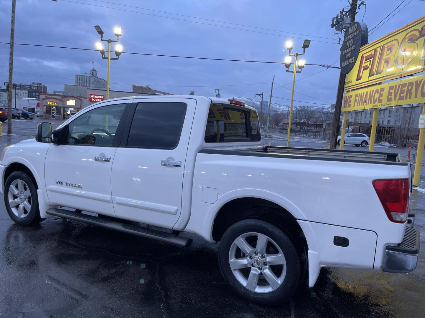 2008 Artic White /Black Nissan Titan LE Crew Cab 4WD SWB (1N6AA07C98N) with an 5.6L V8 DOHC 32V engine, 5-Speed Automatic Overdrive transmission, located at 801 South State Street, Salt Lake City, UT, 84111, (801) 328-0098, 40.751953, -111.888206 - Super clean nice truck! Runs great! 4x4 perfect all year around truck! Clean title no accidents on the Carfax history report! Features: 20 Inch Plus Wheels, Leather Seats, 4WD/AWD, Memory Seat(s), Alloy Wheels, Rockford Fosgate Sound, Front Seat Heaters, ABS Brakes, Automatic Transmission, Power L - Photo#11