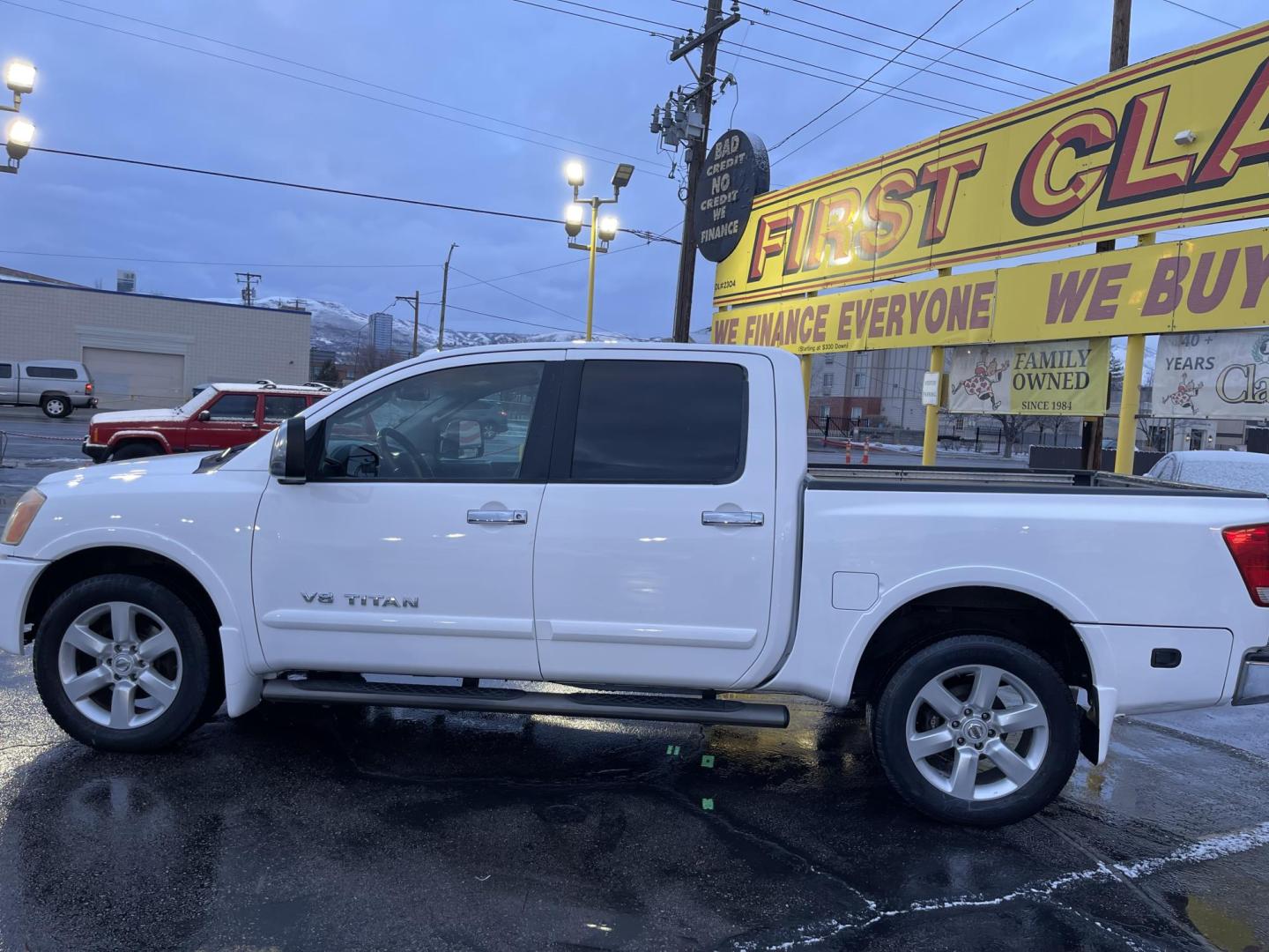 2008 Artic White /Black Nissan Titan LE Crew Cab 4WD SWB (1N6AA07C98N) with an 5.6L V8 DOHC 32V engine, 5-Speed Automatic Overdrive transmission, located at 801 South State Street, Salt Lake City, UT, 84111, (801) 328-0098, 40.751953, -111.888206 - Super clean nice truck! Runs great! 4x4 perfect all year around truck! Clean title no accidents on the Carfax history report! Features: 20 Inch Plus Wheels, Leather Seats, 4WD/AWD, Memory Seat(s), Alloy Wheels, Rockford Fosgate Sound, Front Seat Heaters, ABS Brakes, Automatic Transmission, Power L - Photo#12