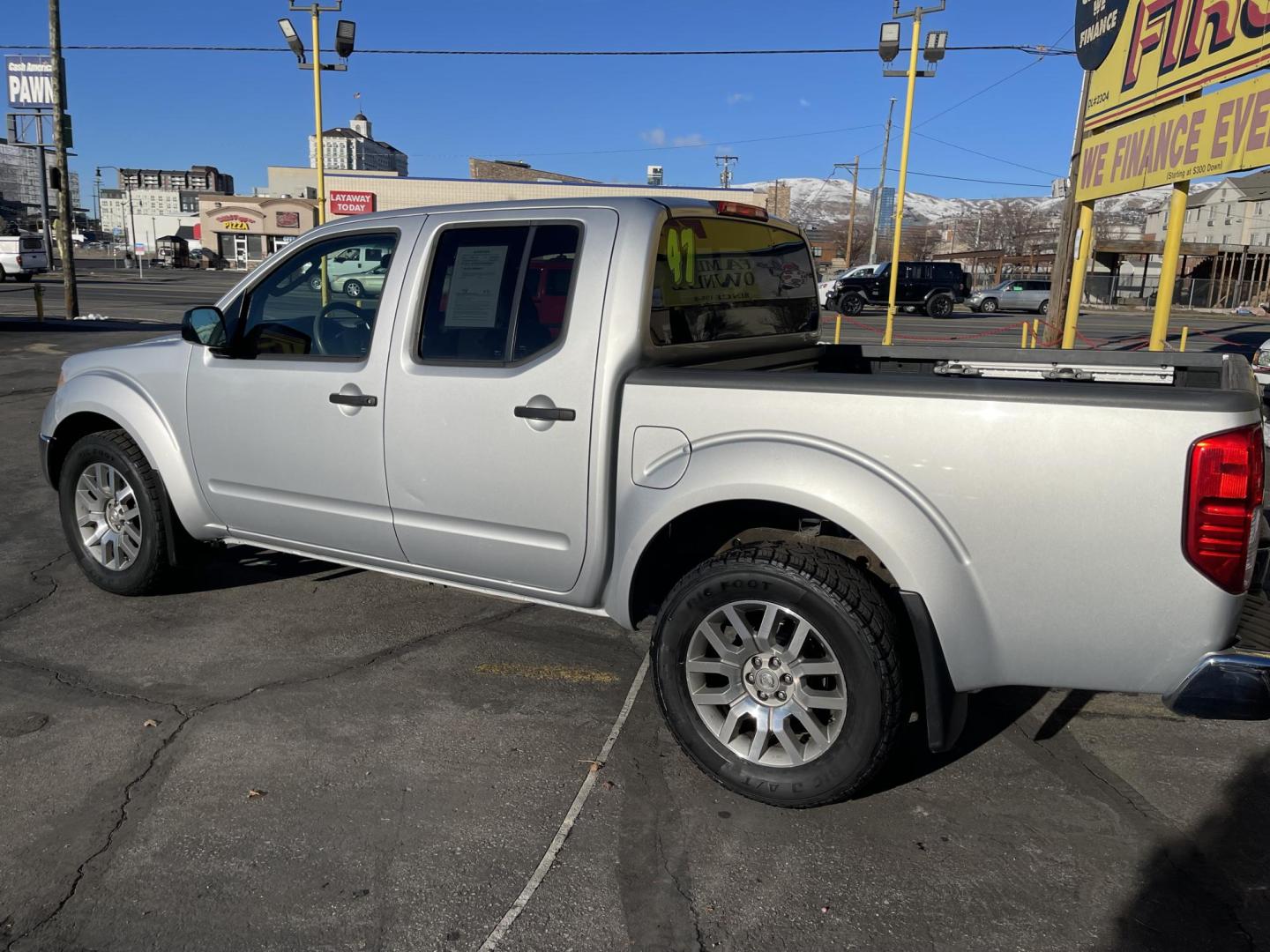 2010 Moondust Silver Metallic /Black Nissan Frontier LE Crew Cab 4WD (1N6AD0EV2AC) with an 4.0L V6 DOHC 24V engine, 5-Speed Automatic transmission, located at 801 South State Street, Salt Lake City, UT, 84111, (801) 328-0098, 40.751953, -111.888206 - Clean title! Hard to find nice 4x4 truck in great shape! Must see for anyone looking for a nice affordable truck! Features: 4x4, Bed Liner, Alloy Wheels, Cloth Seats, ABS Brakes, Automatic Transmission, Overhead Airbags, Traction Control, AM/FM Stereo, Auxiliary Audio Input, Rear Defroster, Air Con - Photo#10