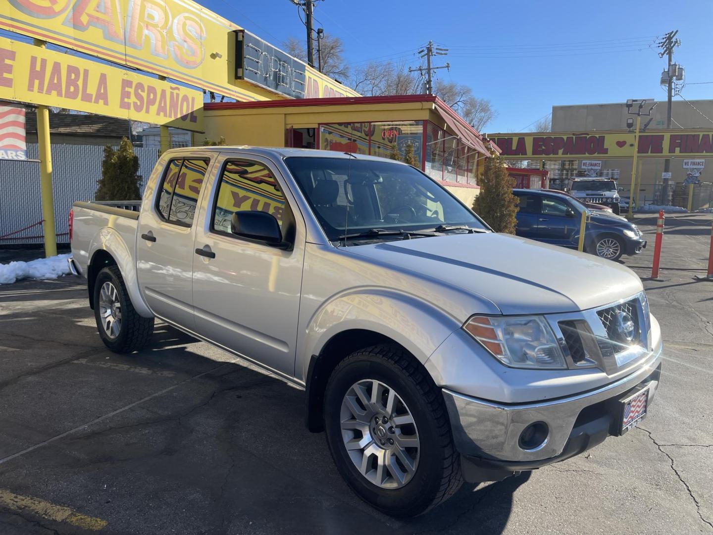 2010 Moondust Silver Metallic /Black Nissan Frontier LE Crew Cab 4WD (1N6AD0EV2AC) with an 4.0L V6 DOHC 24V engine, 5-Speed Automatic transmission, located at 801 South State Street, Salt Lake City, UT, 84111, (801) 328-0098, 40.751953, -111.888206 - Clean title! Hard to find nice 4x4 truck in great shape! Must see for anyone looking for a nice affordable truck! Features: 4x4, Bed Liner, Alloy Wheels, Cloth Seats, ABS Brakes, Automatic Transmission, Overhead Airbags, Traction Control, AM/FM Stereo, Auxiliary Audio Input, Rear Defroster, Air Con - Photo#3