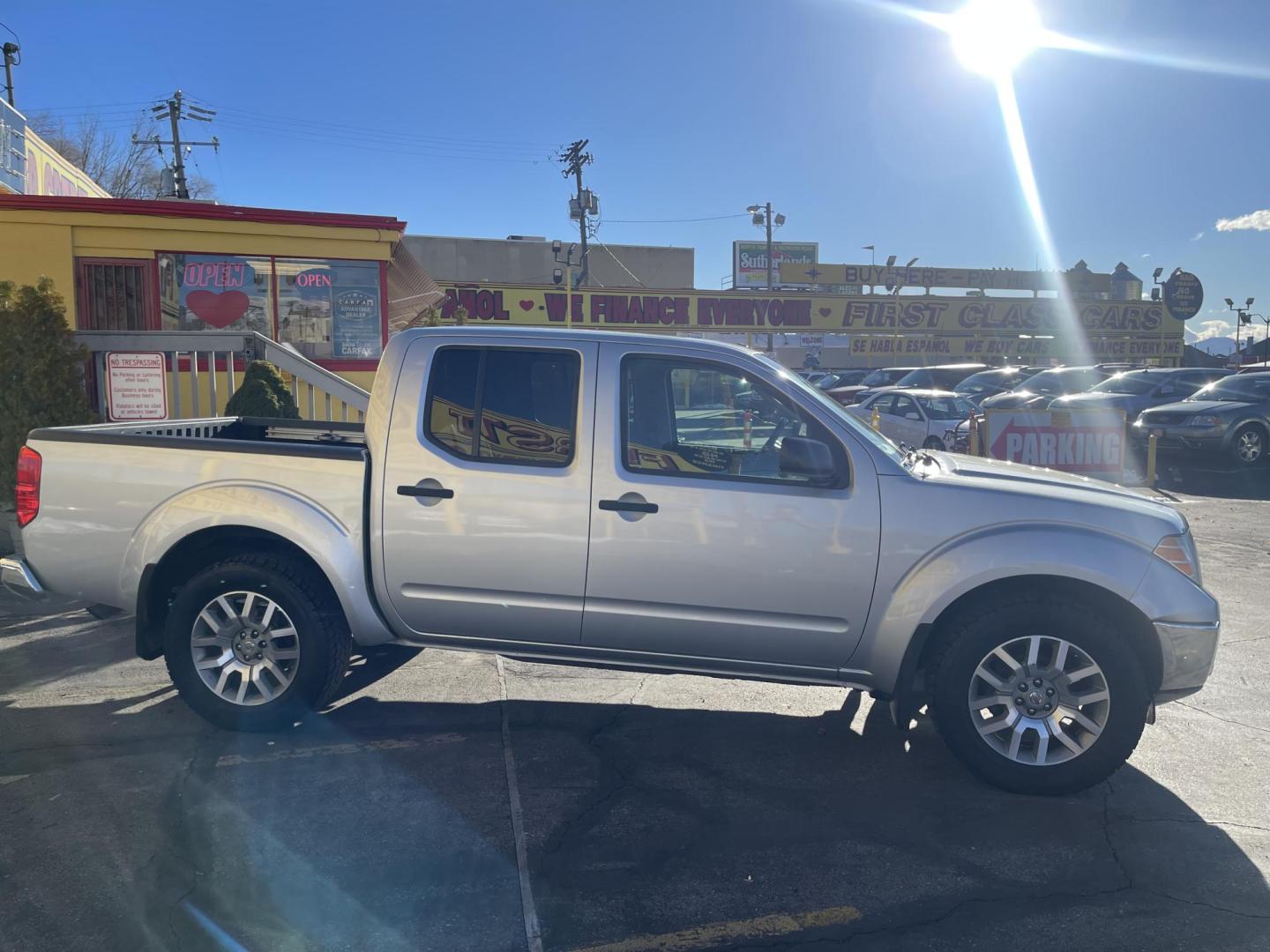 2010 Moondust Silver Metallic /Black Nissan Frontier LE Crew Cab 4WD (1N6AD0EV2AC) with an 4.0L V6 DOHC 24V engine, 5-Speed Automatic transmission, located at 801 South State Street, Salt Lake City, UT, 84111, (801) 328-0098, 40.751953, -111.888206 - Clean title! Hard to find nice 4x4 truck in great shape! Must see for anyone looking for a nice affordable truck! Features: 4x4, Bed Liner, Alloy Wheels, Cloth Seats, ABS Brakes, Automatic Transmission, Overhead Airbags, Traction Control, AM/FM Stereo, Auxiliary Audio Input, Rear Defroster, Air Con - Photo#4