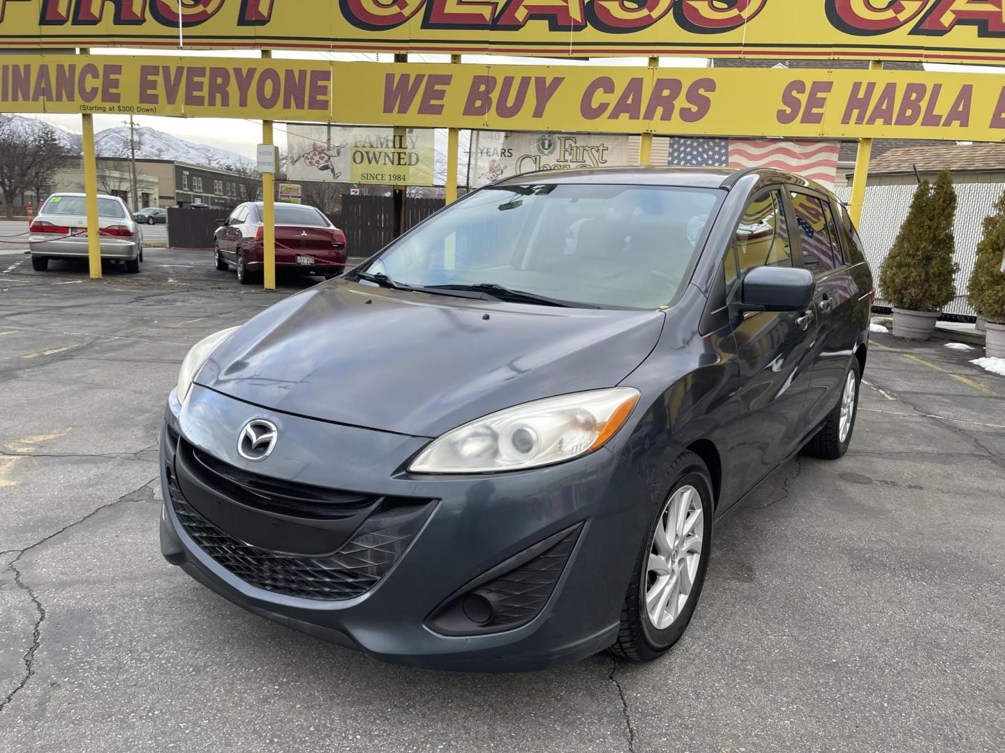 2012 Metropolitan Gray Metallic /Gray Cloth Mazda Mazda5 Sport (JM1CW2BL5C0) with an 2.5L I4 engine, Manual transmission, located at 801 South State Street, Salt Lake City, UT, 84111, (801) 328-0098, 40.751953, -111.888206 - Cool family minivan! Has sliding doors and feels like a miniature minivan. Vehicle Features: Sport Model, 3rd Rear Seat, ABS Brakes, Air Conditioning, Alloy Wheels, AM-FM Stereo, Auxiliary Audio Input, CD Audio, Cloth Seats, Cruise Control, Fold-Away Third Row, Manual Transmission, Overhead Airba - Photo#1