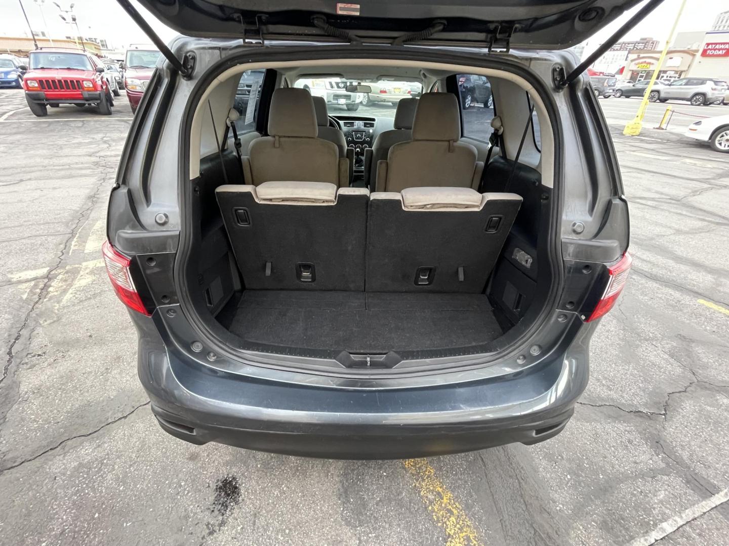 2012 Metropolitan Gray Metallic /Gray Cloth Mazda Mazda5 Sport (JM1CW2BL5C0) with an 2.5L I4 engine, Manual transmission, located at 801 South State Street, Salt Lake City, UT, 84111, (801) 328-0098, 40.751953, -111.888206 - Cool family minivan! Has sliding doors and feels like a miniature minivan. Vehicle Features: Sport Model, 3rd Rear Seat, ABS Brakes, Air Conditioning, Alloy Wheels, AM-FM Stereo, Auxiliary Audio Input, CD Audio, Cloth Seats, Cruise Control, Fold-Away Third Row, Manual Transmission, Overhead Airba - Photo#20