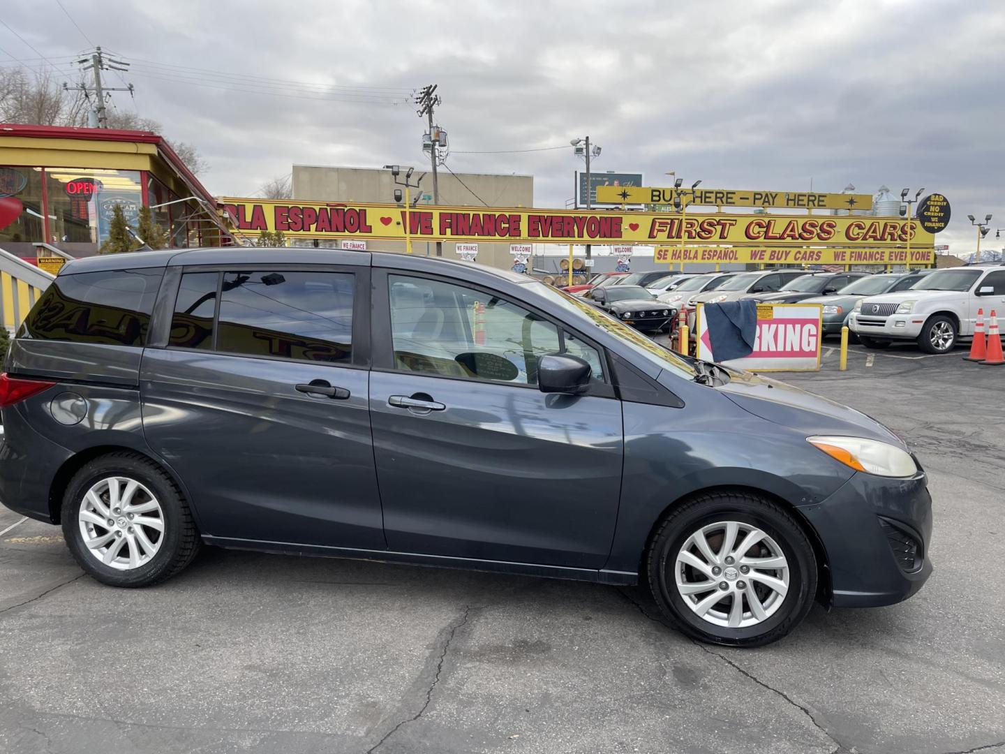 2012 Metropolitan Gray Metallic /Gray Cloth Mazda Mazda5 Sport (JM1CW2BL5C0) with an 2.5L I4 engine, Manual transmission, located at 801 South State Street, Salt Lake City, UT, 84111, (801) 328-0098, 40.751953, -111.888206 - Cool family minivan! Has sliding doors and feels like a miniature minivan. Vehicle Features: Sport Model, 3rd Rear Seat, ABS Brakes, Air Conditioning, Alloy Wheels, AM-FM Stereo, Auxiliary Audio Input, CD Audio, Cloth Seats, Cruise Control, Fold-Away Third Row, Manual Transmission, Overhead Airba - Photo#4