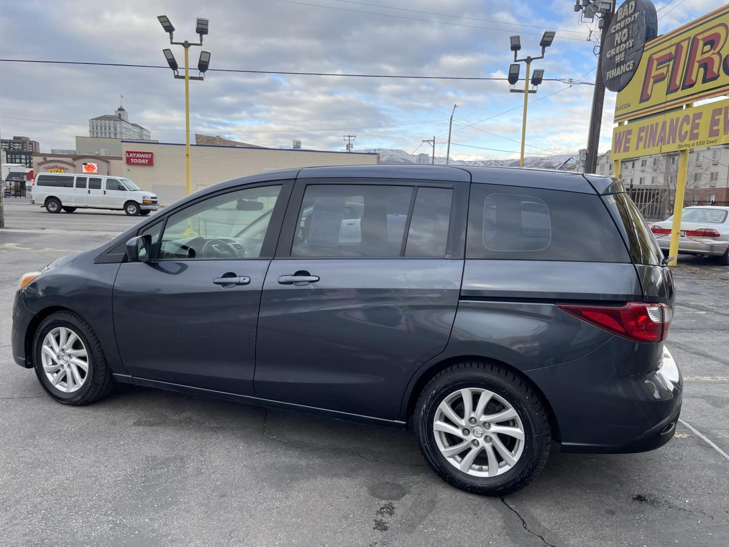 2012 Metropolitan Gray Metallic /Gray Cloth Mazda Mazda5 Sport (JM1CW2BL5C0) with an 2.5L I4 engine, Manual transmission, located at 801 South State Street, Salt Lake City, UT, 84111, (801) 328-0098, 40.751953, -111.888206 - Cool family minivan! Has sliding doors and feels like a miniature minivan. Vehicle Features: Sport Model, 3rd Rear Seat, ABS Brakes, Air Conditioning, Alloy Wheels, AM-FM Stereo, Auxiliary Audio Input, CD Audio, Cloth Seats, Cruise Control, Fold-Away Third Row, Manual Transmission, Overhead Airba - Photo#8